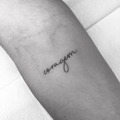 a tattoo with the word oxygen written in cursive writing on it's arm