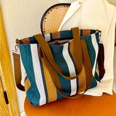 Brand New Never Used Teal, Gold And White. Colorful Striped Summer Cross Body/ Shoulder Bag Attractive, Lightweight Weave Design Third Picture From The Top Is For Size Reference Only And It's Not The Color Of The Bag. Versatile Summer And Shopper Bag Size: 11" X 14" X 4" Approximately All Offers Are Welcome And Thank You For Stopping By My Closet! If You Have Any Questions Please Leave Them In The Comment Field. Thanks Multicolor Shoulder Bag With Adjustable Handle For On-the-go, Blue Top Handle Bucket Bag With Large Capacity, Blue Canvas Shoulder Bag With Top Handle, Casual Blue Top Handle Bucket Bag, Multicolor Large Capacity Crossbody Bag, Blue Bucket Bag With Top Carry Handle For Travel, Blue Canvas Bag With Large Capacity And Double Handle, Blue Bags With Top Carry Handle For Daily Use, Blue Bags With Handles For Daily Use