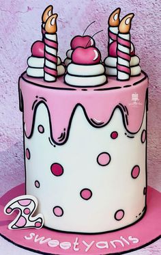 a pink and white birthday cake with candles on top