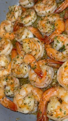 cooked shrimp with herbs and seasoning in a pan