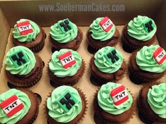 twelve cupcakes with green frosting in a box on top of each other