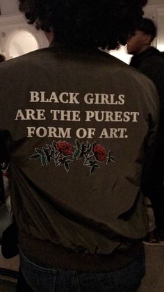 black girls are the purest form of art on a woman's jacket that reads, black girls are the purest form of art