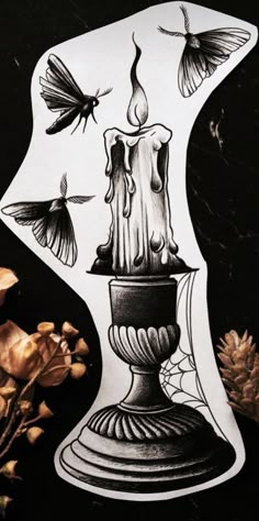 a drawing of a candle and some flowers on a black background with butterflies flying around it