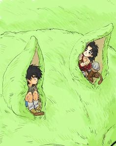 two people sitting in the middle of a giant green pillow