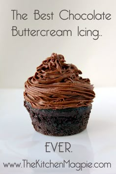 a chocolate cupcake sitting on top of a white table