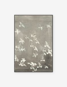 a painting with white birds flying in the air on a gray background and black frame