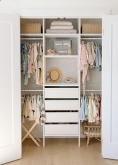 an open closet with clothes and other items