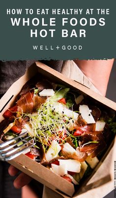 a person holding a box with food in it and the title how to eat healthy at the whole foods hot bar