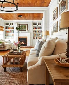 a living room filled with furniture and a fire place