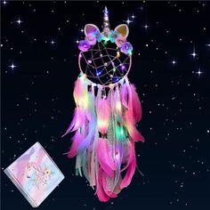 an image of a dream catcher with lights on it's head and mouse ears