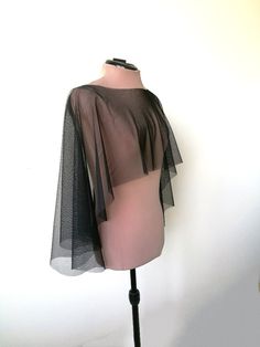 "Halloween cape, Black tulle  capelet, , Witch cover up This is simply  tulle cape, will be perfect compliment for your Halloween dress, Gothic or Vampire look.  Also It has a romantic yet minimalist feel, and would match many gown styles. DETAILS COLOR   - Black  LENGTH  front side- 30 cm (11,8'') back side 50 cm (20 \") SIZE  One size **IMPORTANT** * CUSTOMER WILL PAY FOR SHIPPING IN CASE OF RETURN *colours may vary from originals depending on computer monitor or smartphone settings. The produ Black Cape For Costume Party, Sheer Black Tulle Fabric For Party, Black Shrug For Fall Party, Chic Capelet For Party, Elegant Fitted Cape For Costume Party, Chic Capelet With Cape Sleeves For Party, Chic Fitted Capelet For Parties, Chic Black Cape With Cape Sleeves, Black Evening Cape