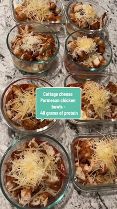 six glass bowls filled with different types of pasta and sauces on top of a marble counter