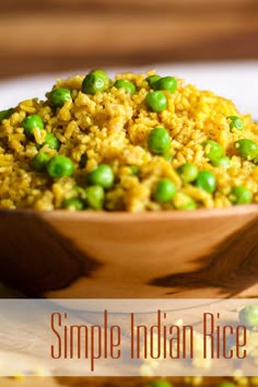 a wooden bowl filled with rice and peas