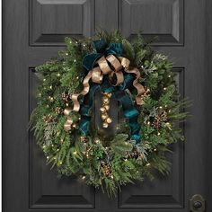 a christmas wreath hanging on the front door