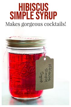 a mason jar filled with red liquid and labeled hibiscus simple syrup makes gorgeous cocktails