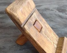 a small wooden object sitting on top of a table