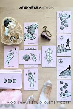 the moon tarot cards are laid out on a table next to some other items