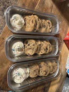 three plastic containers filled with cookies and whipped cream