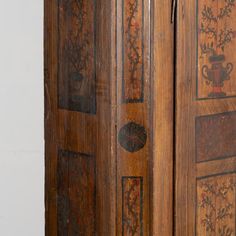 an old wooden armoire with decorative designs