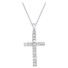 Make a bold statement of style and beliefs with the eye-catching elegance of this diamond cross pendant. Beautifully crafted by our inhouse experts in 14 karat white gold and embellished with 44 round brilliant cut & baguette cut diamond set in channel setting. The total diamond weight is 0.50 carat and it shines in H-I color I-2 clarity. Pendant suspends along a cable chain that secures with a spring-ring clasp. Diamond Circle Pendant, Gold Cross Pendant, Circle Pendant Necklace, Halo Pendant, Diamond Cross Pendants, Rose Pendant, Contemporary Pendant, Baguette Cut Diamond, Diamond Cross