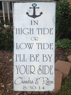 a sign that says in high tide or low tide i'll be by your side