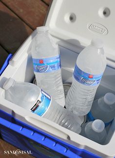 two bottles of water are in a cooler