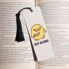 a bookmark with an image of a yellow duck on it and the words keep reading