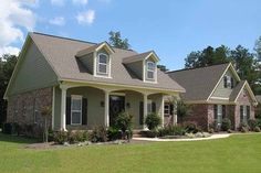 a large house in the middle of a grassy area