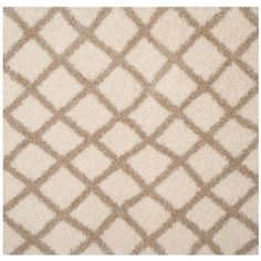 a white rug with brown squares on the top and bottom, in an area that is very