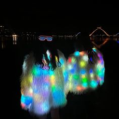 This amazing led fur coat will be the light of any party.  It is a showstopper, you will have so much fun wearing it in a dance performance or at a dressy dinner dance Neon glow led jacket: It is built in 160pcs rainbow sparkly blinking led string lights, bright and shining, all eyes will be on your lol and a huge hit at your party,  Workable Battery: Requires 3 - AA 1.5V, pcs (batteries not included) Super warm and super soft super fun!  Three sizes are available (small, medium, large), this light up jacket is fit for both men and women, a fashion style at burning man costume party, clubs, carnival festival ,rave outfit, Stage Performance, a nice gift for couples and lovers, also can be a family dress at Christmas party Washing instruction: Dry cleaning is recommended Led Jacket, Birthday Fancy, White Faux Fur Jacket, Rave Costume, Burning Man Costume, Rave Costumes, Carnival Festival, Rave Outfit, Neon Glow