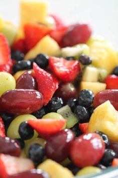 fruit salad with grapes, strawberries, pineapples and kiwi