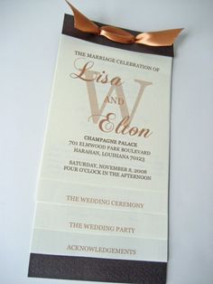 an elegant wedding program with gold ribbon on the front and black back, is displayed