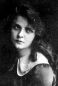 an old black and white photo of a woman