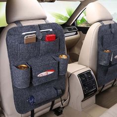 the interior of a car with several pockets on it