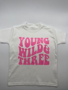 Young Wild & Three T-shirt  T-shirt Colour: - White  Material: 100% Cotton Available Sizes: * 0-3 months * 3-6 months  * 6-12 months  * 1-2 years * 2-3 years * 3-4 years * 4-5 years  * 5-6 years Font Colours: - pale pink - pale blue - beige  - black - navy blue - gold - silver  - lavender  - rose gold - bright pink Personalisation: Please confirm name you wish printed on the back of the T-shirt in the personalisation box before check out. If you do not wish a name printed on the back please leav Kids Graphic Tees, Third Birthday, Toddler Tees, Personalised Kids, Bright Pink, Black And Navy, Kids Tshirts, Kids Birthday, Baby Clothes