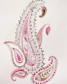 an intricately colored paisley design on a white paper background with pink and brown accents