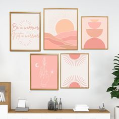 four framed art pieces hang on the wall above a white dresser with drawers and a potted plant