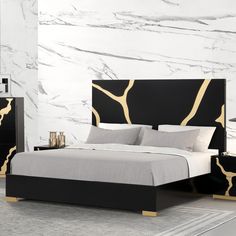 a bedroom with marble walls and black furniture