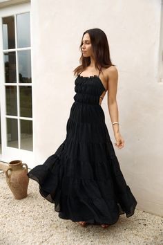 Step into timeless elegance with our Renaissance Art Maxi Dress in Black. Whether you're attending a garden wedding or exploring historic landmarks. this dress exudes sophistication and grace. Style with black heels and gold adornments to elevate the look. Maxi dress. true to size Adjustable back strap Tie back details Exposed back Flowy skirt Semi-elasticated bust and waist Lined 100% Polyester Non-stretch material Please refer to the care label on garment for specific instructions on how to care for it Model wears XS Length from shoulder to hem: 127cm on an S Chest 30cm. Waist 27cm. size S Long Black Flowy Dress, Long Fitted Dress, Flowy Dress Casual, Black Flowy Dress, Spring Break Dress, Historic Landmarks, Long Fitted Dresses, Cocktail Dress Formal, Crop Dress