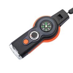 an orange and black tool with a compass on it's handle is shown in front of a white background