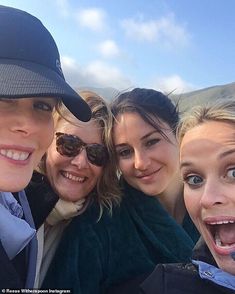 a group of young women taking a selfie in front of the camera with their mouths open