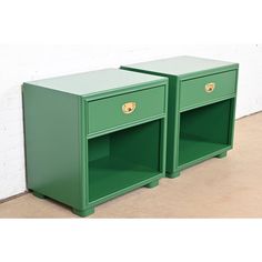 two green nightstands side by side against a white brick wall