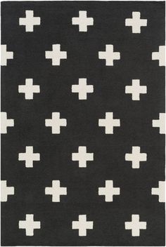 a black and white rug with crosses on it