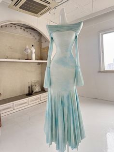 This enchanting dress features an elegant off-shoulder fold-over neckline, adding a touch of sophistication to any occasion. The fabric is adorned with delicate floral patterns, beautifully blending shades of blue and green for a refreshing and graceful look. The mermaid silhouette is expertly crafted with curved tailoring, allowing the skirt to flow gracefully with every step, exuding an air of refined elegance.  Please note that the price includes one dress only.   	 		 			Size 			XS 			S 			M Shades Of Blue And Green, Enchanting Dress, Mermaid Skirt, Mermaid Silhouette, Skirt Dress, Floral Patterns, Blue And Green, Shades Of Blue, Mint Green