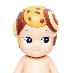 a baby doll with a yellow hat on it's head and brown hair is looking at the camera