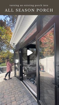 a woman walking into an outdoor patio with the words all season porch written on it