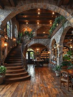 the inside of a house with stone walls and stairs leading up to an open floor plan