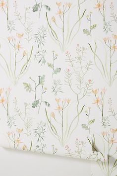 a wallpaper with flowers and leaves on it's back side, in pastel colors