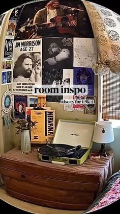 a desk with a laptop computer on top of it next to a lamp and pictures