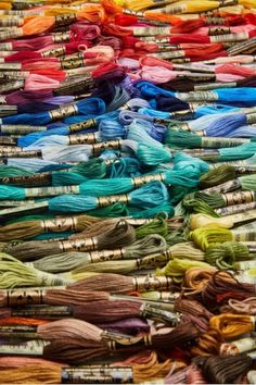 many skeins of thread are stacked together